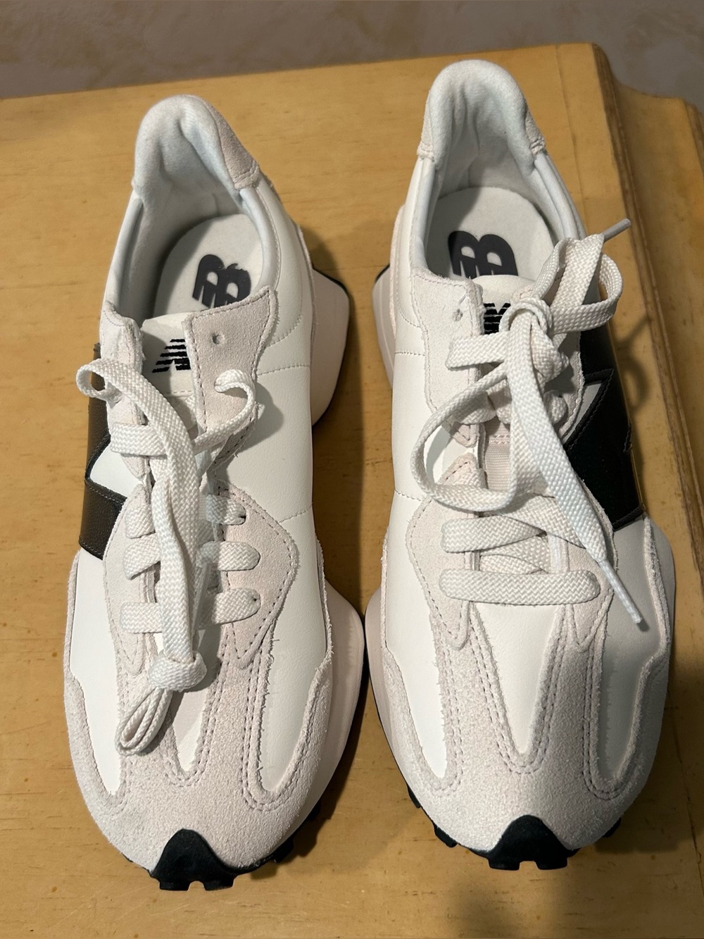New balance womens 327 leather, suede, black and white sneaker in size 7